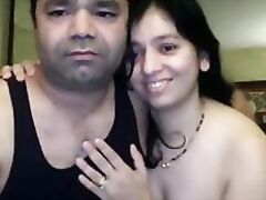 Cute Indian babe sucking her partners cock licking his balls during foreplay while he pumps his dick